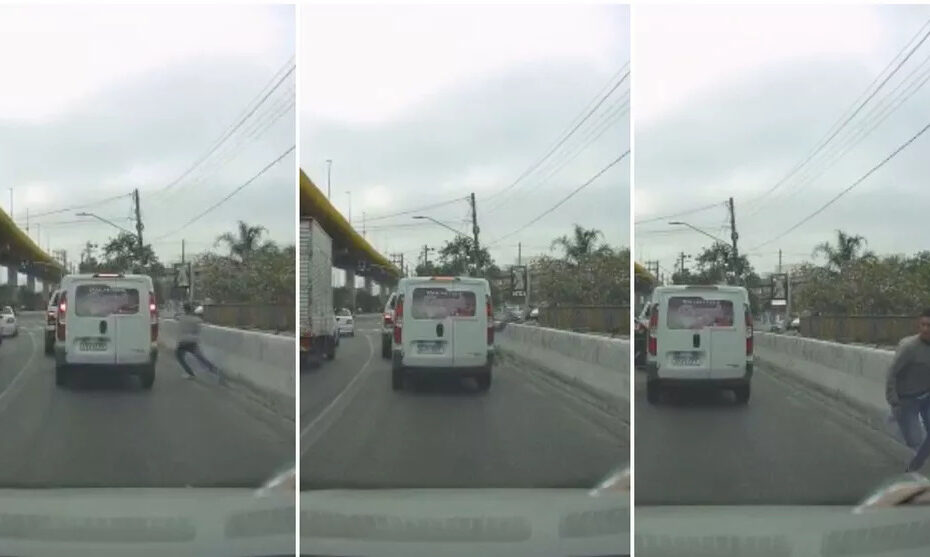Homem quebra vidro e pula dentro de carro para assaltar motorista durante congestionamento